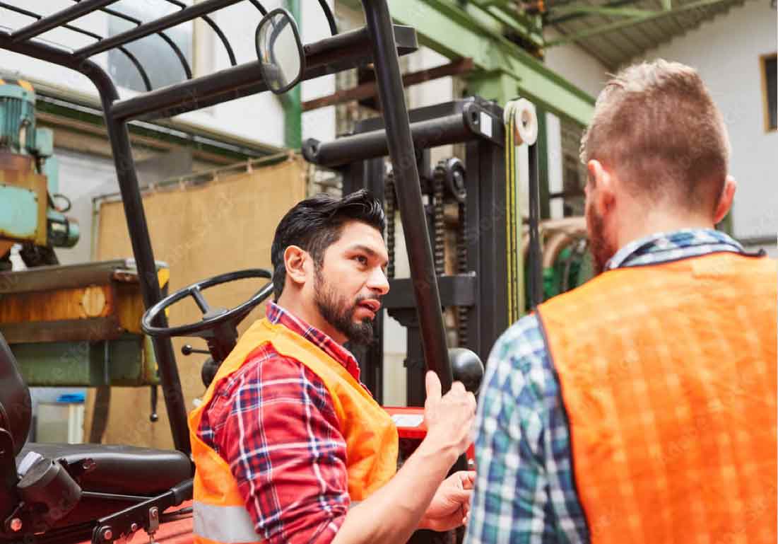 men talking in warehoue